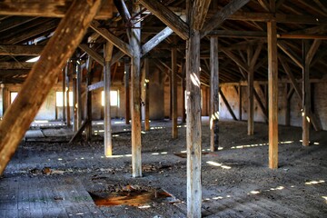 Old and dirty attic with bright daylight coming from outside