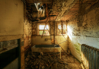 Ruined washing room in an abandoned building