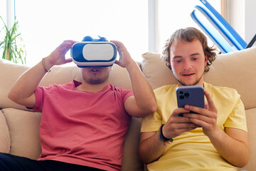 Gay couple using VR goggles in home