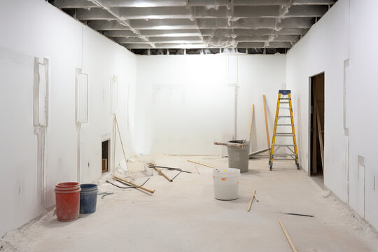 Generative AI image of empty space with painted white walls and painting work tools during renovation