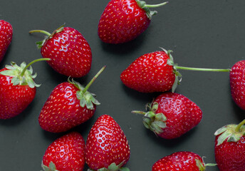 Macro strawberry isolated. closeup whole strawberries with leaf on black background. top view set, Fresh juicy strawberries with leaves, Fresh strawberries.Juice strawberry, ripe organic