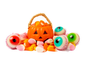 Halloween corn, jelly eyes, sugar skull and pumpkin candy isolated on white background. Classic sweet treats for Halloween. Halloween holiday concept with corn and jack o lantern.