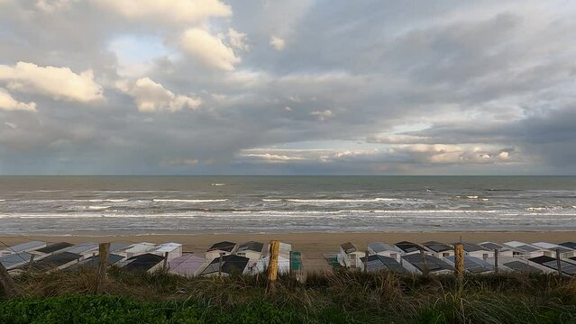 Early morning on the beach, wooden beach houses, Zandvoort, Nord Sea, the Netherlands