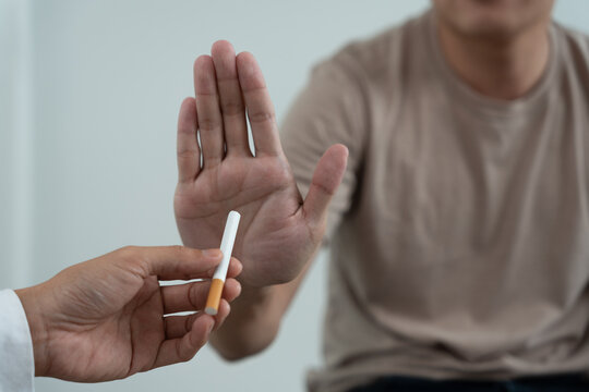 No smoking. Man stop smoke, refuse, reject, break take cigarette, say no. quit smoking for health. world tobacco day. drugs, Lung Cancer, emphysema , Pulmonary disease, narcotic, nicotine effect