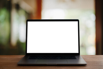 Fototapeta premium laptop with screen on wooden table 