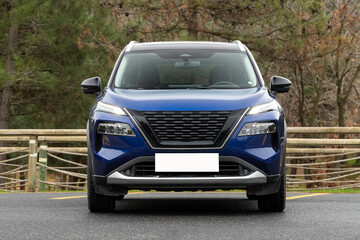 A blue suv car is parked in a parking lot easy to use mockup