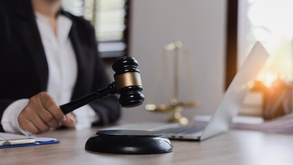 Fototapeta na wymiar Advice and Legal services Concept. Judge gavel with Justice lawyers, Businesswoman in suit or lawyer working with laptop at desk.