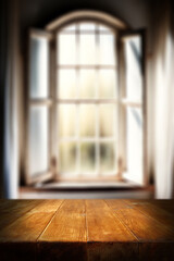 Desk of free space and blurred window background. 