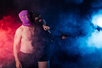bandits with a machine gun in a room with smoke