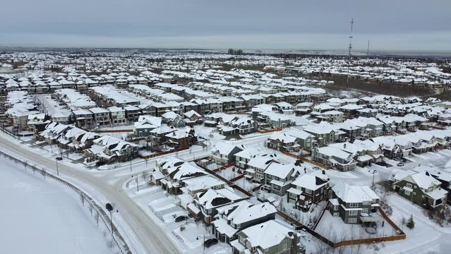 Aerial view of suburban Calgary in winter - looking towards the mountains on the west side. 