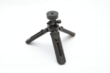 The mini tripod is made of plastic that can be folded.