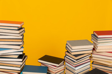 learning science stack of books in the library on a yellow background education