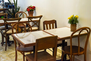 Loft style with wooden furniture in a Vietnamese coffee shop 