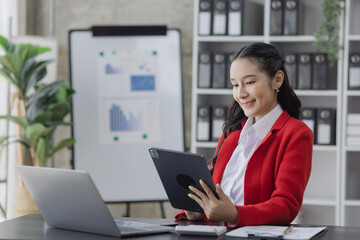 Asian business woman working at table office, business finance technology, financial document and business accounting. 