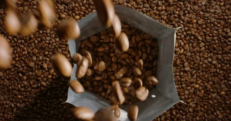 Natural roasted coffee beans fall pour in package for storage, transportation