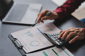 Portrait of office worker working on tablet computer in modern office make account analysis report Real estate investment information, financial and tax system concept