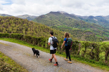 Young couple hiking in the mountains of the French Basque Country