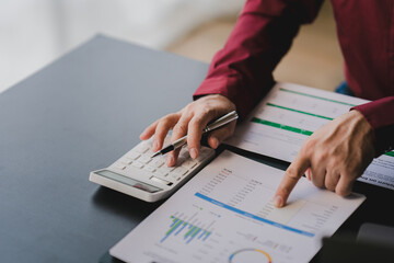 Portrait of man working on tablet computer in modern office make account analysis report Real estate investment information, financial and tax system concept