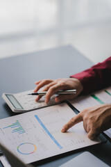 Portrait of man working on tablet computer in modern office make account analysis report Real estate investment information, financial and tax system concept