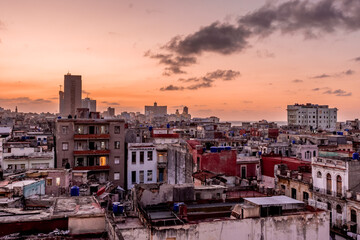 View over the rooftops of Havana in Cuba at sunset with the El National hotel