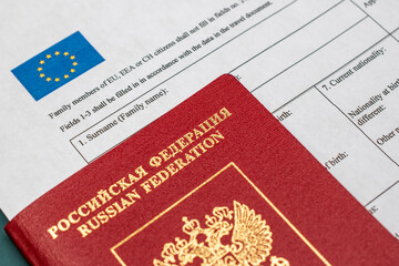 Russian travel passport with Schengen visa application form, sanctions, emigration, immigration, tourism concept