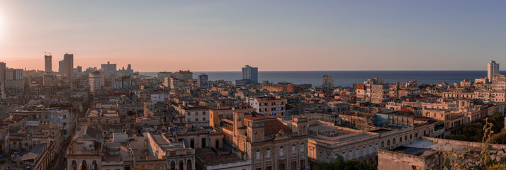 View over the rooftops of Havana in Cuba at sunset with the El National hotel