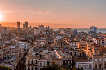 View over the rooftops of Havana in Cuba at sunset with the El National hotel
