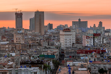 View over the rooftops of Havana in Cuba at sunset with the El National hotel
