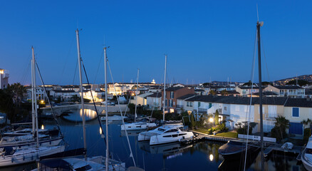 Fototapeta na wymiar View over Port Grimaud marina in France in spring with yachts and sailing boats at evening