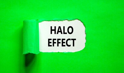 Halo effect and psychological symbol. Concept words Halo effect on beautiful white paper. Beautiful green table green background. Business psychological and Halo effect concept. Copy space.