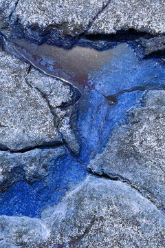 Unusual blue texture of stone sea shore © Elena