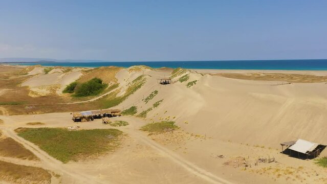 Aerial view of Paoay sand dune. Sand dunes near to the sea with sky. Ilocos Norte, Philippines.