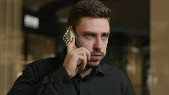 Worried sad Caucasian businessman man talking phone business call upset guy entrepreneur office manager executive CEO male employer calling distant lost job failure smartphone trouble talk mobile chat