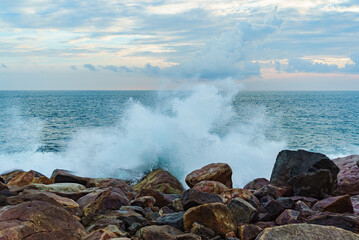 Seascape with big rocks and cloudy sky