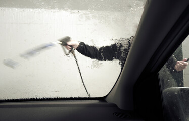 Washing the dirty Car Window
