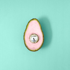 Creative concept colorful avocado with disco ball. Minimal food concept.
