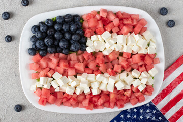 Patriotic salad idea with blueberries, feta and watermelon in the shape of American flag, USA Independence Day, Top view