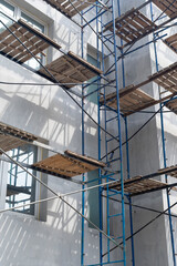 scaffolding on the facade of a house under construction