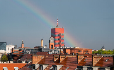 rainbow over city rooftops - cityscape