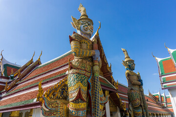 Fototapeta premium Yasha guardians at entrance of Emerald Temple inside Golden Grand Palace in Bangkok, Thailand. Wat Phra Kaew Temple.