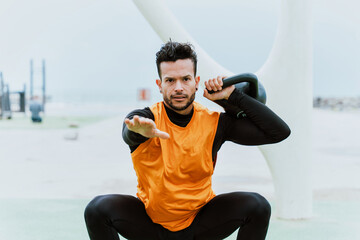 Young athlete training in the morning on the beach at the gym. outdoor. Representation of sport and healthy lifestyle concepts © oneinchpunch