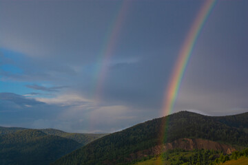Fototapeta na wymiar rainbow over the mountains
