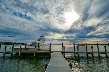 Obraz premium Stormy Spring Sunset over the Intracoastal Waterway, seen from Holiday Harbor Marina, Perdido Key, Florida