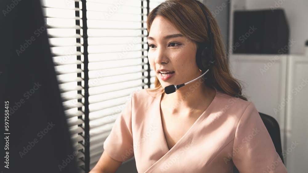Aufkleber competent female operator working on computer and while talking with clients. concept relevant to bo
