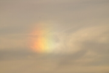 A mini rainbow in the sky as a result of the refraction of light over the Mediterranean Sea. 