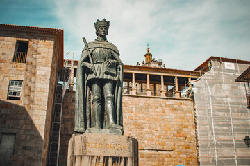 Fototapeta na wymiar Viseu, Portugal - 2023: King Dom Duarte statue near Sé Catedral de Viseu and Igreja da Misericórdia 'Church of Mercy'