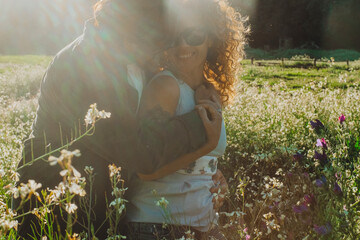 People in outdoor love leisure activity enjoying life in sunset sunlight bonding each other in the...