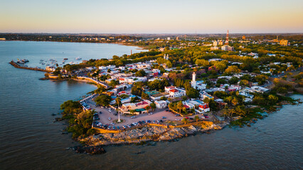 Aerial view Colonia del Sacramento old city lighthouse with glowing sunrise on the Uruguay 