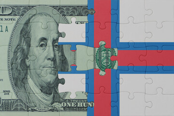 puzzle with the national flag of faroe islands and dollar money banknote. macro.concept.