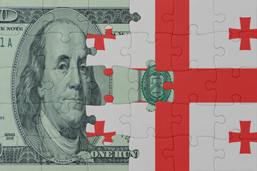 puzzle with the national flag of georgia and dollar money banknote. macro.concept.